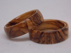 two wooden rings sitting on top of each other