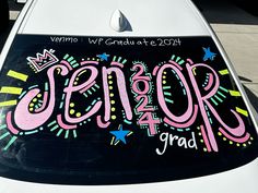 a car with the word senior written on it's hood and decorated with stars