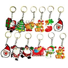 christmas themed key chains with santa claus, snowman, reindeer, and other decorations