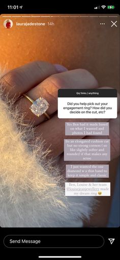 someone is holding their engagement ring in front of the camera and texting it on her phone