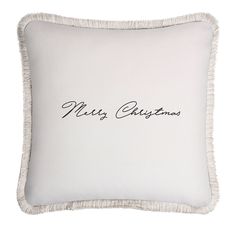 a white pillow with the word merry christmas on it and fringe trimming around the edges