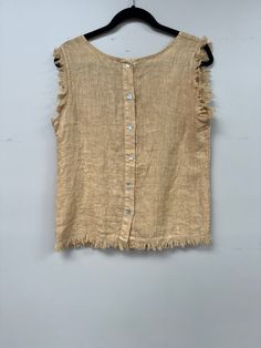 Elevate your wardrobe with our Italian Linen Distressed Hem Tank Top! Made with premium linen, it offers a comfortable and loose fit, perfect for any body size (s-l). The buttoned back, scoop neckline and distressed hem add a touch of style to this basic, versatile piece. Easy to wear, easy to love! Summer Linen Tops With Frayed Hem, Bohemian Linen Sleeveless Tank Top, Summer Linen Tops With Scoop Neck, Summer Linen Top With Scoop Neck, Bohemian Sleeveless Linen Tank Top, Scoop Neck Linen Top For Summer, Distressed Bohemian Tops For Summer, Bohemian Distressed Summer Top, Summer Beach Top With Frayed Hem