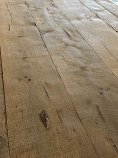 an old wooden floor is being restored