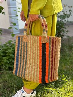 Paper Rope Striped Bag🧶👜 The paper rope striped bag, which attracts attention with its natural and stylish design, is both environmentally friendly and durable accessory. This special handmade bag offers a wide range of uses, from daily use to the beach bag.🌊 While adding a natural and modern touch to your style, it will make you happy to make an environmentally sensitive choice. This special bag, which you can think of as a gift for both yourself and your loved ones, will accompany you at every moment. SIZES Width: 40CM Height:30CM Base width:11CM Height with bag hanger:55CM  I CAN SHIP 2 OR 3 DAYS. Striped Rectangular Straw Bag For Daily Use, Striped Woven Rectangular Straw Bag, Rectangular Striped Woven Straw Bag, Striped Woven Rectangular Shoulder Bag, Rectangular Striped Woven Shoulder Bag, Striped Woven Rectangular Beach Bag, Striped Rectangular Straw Bag With Braided Handles, Striped Woven Tote Bag, Multicolor Jute Bag With Braided Handles