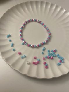 a paper plate with some beads on it