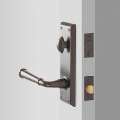 an image of a door handle on the side of a wall with two knobs