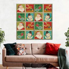 a living room with a couch and christmas themed wall art on the wall above it