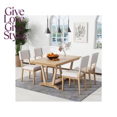 a wooden table with white chairs around it and a potted plant in the middle