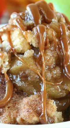 a close up of a plate of food covered in caramel sauce and toppings