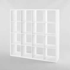 a white bookcase with many compartments on it