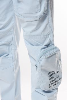 Details Open Bottom Jogger Color: Seabreeze Material: 100% Polyester Style: WP23182 White Nylon Pants With Pockets, Spring Nylon Bottoms With Functional Pockets, White Parachute Pants With Pockets For Outdoor Activities, White Nylon Parachute Pants For Summer, Casual Blue Pants With Functional Pockets, Summer Sports Parachute Pants With Pockets, Casual White Bottoms With Functional Pockets, Casual White Parachute Pants For Outdoor, Casual Nylon Pants With Zip Fly