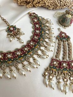 Beautiful pakistani style polki choker set and jhumka  earrings . Lightweight.Gold , pearl and multicolor bead work Dimensions-  Earrings length- 2.5 inches Style tip- Pair it with any beautiful traditional outfits  and flaunt with Unique style of collection from us. Perfect match for Festival and Traditional wear.  Take Care Tips-  Kee away from perfume, Hair spray and. Moisture.  Store in dry place , Ziplock bag or Airtight box.    Clean with dry cloth.  Jewellery is the last thing you should Cheap Meenakari Wedding Jewelry, Luxury Multicolor Jewelry For Diwali, Luxury Fusion Style Chandelier Earrings With Latkans, Affordable Meenakari Jewelry For Festive Season, Luxury Chandbali Jewelry Sets For Festive Occasions, Luxury Chandbali Bracelets For Diwali, Pakistani Jewelry Sets, Holud Jewellery, Jewelry Indian Traditional