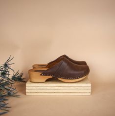 Brown clogs wooden Swedish Clogs handmade slingback leather | Etsy Wooden Slip-on Mules, Vintage Leather Footbed Clogs With Closed Toe, Vintage Leather Footbed Closed Toe Clogs, Brown Wood Slip-on Clogs, Casual Brown Wooden Clogs, Rustic Brown Mules With Round Toe, Rustic Brown Slip-on Clogs, Comfortable Brown Closed Toe Clogs, Rustic Brown Closed Toe Mules