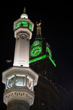 the clock tower is lit up green for st patrick's day