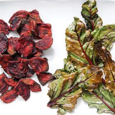 lettuce and beets on a white plate next to some dried beets