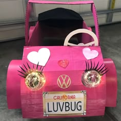 a pink car with hearts and eyelashes painted on it