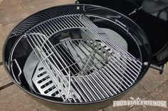 an outdoor bbq grill is shown with the lid open on it's side