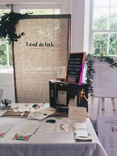 the table is set up with cards and other items for guests to write on it