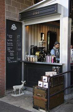 the outside of a small coffee shop