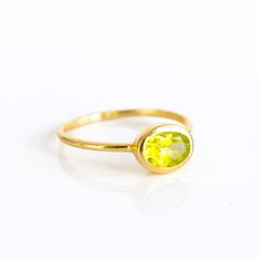 You'll fall in love with the stunning green color of this Peridot Quartz ring. This is a perfectly sized oval to compliment any collection. Popular as a birthday gift for those August babes and Peridot lovers alike. This stone is beautifully faceted and bezel set in a 925 sterling silver band or plated with 18k vermeil gold. Gemstone is approximately 8 x 6mm.Band has 925 stamp on inside.Please note that each ring is handmade and there may be some slight variations from listing photo.Available in Lime Green Gemstone Birthstone Ring As Gift, Lime Green Gemstone Birthstone Ring For Gift, Lime Green Birthstone Ring As A Gift, Green Oval Gemstone Rings, Oval Green Gemstone Birthstone Ring, Green Oval Cabochon Birthstone Jewelry, Green Oval Rings For Promise, Green Oval Cabochon Ring For Gift, Emerald Oval Cabochon Ring Gift