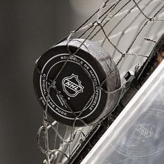 a hockey goalie's net with a black and white sticker on it