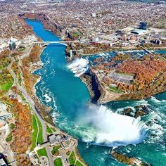 an aerial view of niagara falls and the canadian river in autumn, with fall foliage around it