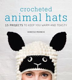 a woman wearing a crocheted animal hat