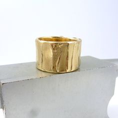 "Wide Bronze Ring, Rustic Bronze Ring, Boho Wide Gold Ring, Ancient Bronze Ring, Wide Gold Ring, \"Cakewalk Ring\" Multiple layers of bronze are used to create this unique surface texture Width is approximately 1/2 inch or a little more with organic edges Every ring is handmade. All of my rings are one of a kind and unique works of art. Each ring is unique and will be similar to the images but may vary slightly in width and pattern. Each ring has its own character with organic edges, undulating Handmade Thick Band Jewelry As Gift, Handmade Wide Band Ring For Promise, Handmade Adjustable Wide Band Ring For Wedding, Gold Wide Band Stackable Rings Gift, Unique Wide Band Ring As Gift, Artisan Adjustable Yellow Gold Ring, Handmade Adjustable Wide Band Stackable Rings, Handmade Wide Band Ring Gift, Handmade Wide Band Ring For Gift