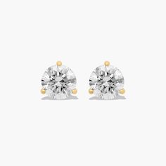 14K Yellow Gold Three Prong Martini Round Diamond Stud Earrings (1.50 CTW - H-I / SI1-SI2). These three-prong martini setting is constructed to fit the exact size of the diamonds used. The diamonds sit perfectly flush into the setting; exactly as the Martini design was intended. White Round Diamond Cut Earrings, Formal White Diamond Earrings With Single Diamond, White Diamond Earrings With Single Diamond, Formal White Single Diamond Earrings, White Diamond Earrings With Vvs Clarity, Round Cut, White Round Cut Diamond Earrings With Vvs Clarity, White Round Diamond Earrings, Everyday Luxury White Diamond Earrings, Classic White Cubic Zirconia Diamond Earrings