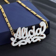 Double plated Name Necklace with underline half filled heart accent personalized and custom-made with your desired text. Our double layer 3D nameplate jewelry is handcrafted with 14K Gold-filled Stainless Steel meaning it is waterproof, hypoallergenic, non tarnish, and everlasting! These are the perfect gifts for the King and Queen in your life. They scream elegance, luxury, and style all while being friendly to your pockets! DETAILS: -Waterproof, tarnish-resistant, rust-resistant, hypoallergeni Nameplate Jewelry, Name Plate Necklace, Arabic Jewelry, Pockets Details, Name Necklace Silver, Name Necklace Gold, Necklace Name, Jewelry Charms Pendants, Bangle Ring