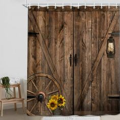 sunflowers and wagon wheel in front of an old barn door shower curtain set