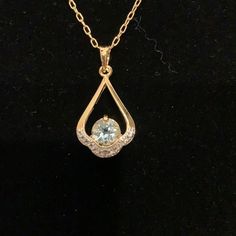 2 Ct Blue Topaz & Diamond Accent Pendant 22kt Nib Bought At Estate Sales Says 22kt Gold/Brass Gold Aquamarine Jewelry With Accent Stones, Formal Yellow Gold Aquamarine Necklace, Gold Blue Topaz Teardrop Pendant, Elegant Gold Necklace With Accent Stones, Elegant Gold Necklaces With Accent Stones, Gold Aquamarine Teardrop Jewelry, Round Aquamarine Gold Jewelry, Gold Aquamarine Jewelry With Gemstone Accents, Gold Blue Topaz Drop Jewelry