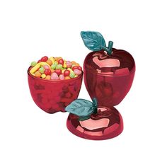 an apple and bowl filled with candy on top of each other next to another one