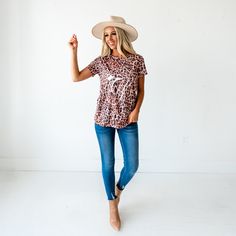 Rock your outfit in this super cute leopard print top! Pair this top with jeans, a denim jacket, and heels for a stylish look. Sizes: Small 0-4 Medium 6-8 Large 10-12 Material: 95% Polyester 5% Spandex Blend. Product Fit: Relaxed fit, True to size. Length of small is 26". Model info: 5'6" Wearing size small. Leopard Graphic, Top With Jeans, Cute Leopard, Leopard Print Top, Graphic Top, Print Top, Print Tops, Floral Tops, Graphic Tee