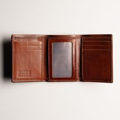 Introducing the epitome of fine Italian craftsmanship - the Trifold Italian Leather Wallet, meticulously made in the heart of Tuscany. This sophisticated accessory embodies both elegance and practicality, designed to enhance your everyday style while securely organizing your essentials. Crafted from the finest Italian leather, this wallet exudes a luxurious feel that only genuine Tuscan artisans can achieve. Each stitch is carefully placed, reflecting their unparalleled attention to detail and d Brown Waxed Finish Trifold Wallet, Luxury Elegant Brown Trifold Wallet, Luxury Brown Bifold Wallet, Vintage Hand-tooled Leather Trifold Wallet, Brown Leather-lined Trifold Wallet, Trifold Wallet, Italian Leather, Leather Wallet, Everyday Fashion