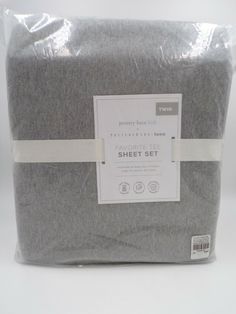 the grey sheet set is wrapped in plastic