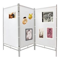 a white room divider with pictures on it