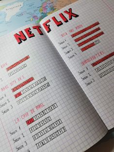 an open notebook with the words netflix written in red and black on top of it