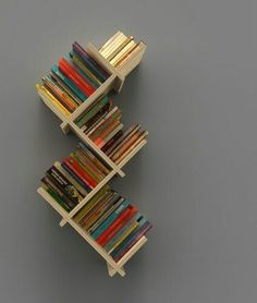 three bookshelves are stacked on top of each other