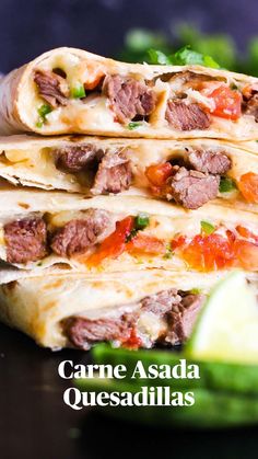 three quesadillas stacked on top of each other with meat and vegetables in the background