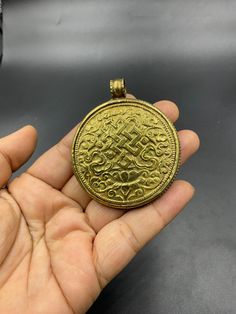 Very nice vintage design handmade tibetan gold plated pendant Gold Locket Necklace In Copper, Gold Jewelry With Large Pendant For Rituals, Traditional Coin-shaped Brass Necklaces, Traditional Coin Shaped Brass Necklace, Gold Medallion Copper Jewelry, Gold Copper Medallion Jewelry, Gold Amulet Necklace With Antique Finish, Traditional Bronze Coin Pendant Jewelry, Traditional Bronze Round Pendant Necklace