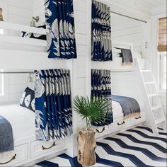 an instagram page with two bunk beds and blue striped rugs on the floor