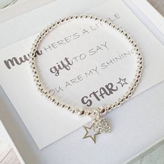 Treat your mum ♡ to this fabulous handmade Sterling Silver Stretch Bracelet.  This looks lovely alone or can stack it with other bracelets.  The card inside reads - Mum, HERE'S A LITTLE gift TO SAY YOU ARE MY SHINING STAR ☆  Each bracelet is produced lovingly by hand so you know that extra special care went into making it. ⭐ 3mm & 5mm Sterling Silver Balls ⭐ 10mm Sterling Silver Open Star Charm ⭐ 7mm Sterling Silver cz Heart Charm  ⭐ Beautifully Boxed with a Mini Silver Polishing Cloth  To measu Silver Heart Charm Stretch Bracelet, Silver Stretch Bracelet With Heart Charm, Adjustable Stretch Bracelet With Star Charm As Gift, Heart-shaped Silver Beaded Bracelets For Gifts, Heart-shaped Silver Beaded Bracelet For Gift, Heart-shaped Silver Beaded Bracelet Gift, Adjustable Heart Bracelet With Silver Beads For Gift, Heart Shaped Silver Beaded Bracelet For Gift, Silver Heart Bracelets For Birthday