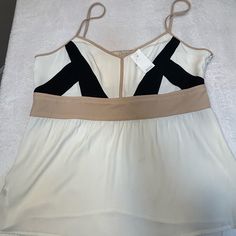 Loft Women’s White, Tan And Black Sleeveless Top Side Zipper Spaghetti Straps Never Worn And Comes With Tag Great Condition Size: 6 White Tank Top With Built-in Bra For Day Out, Beige Tank Top With Built-in Bra For Spring, White Sleeveless Camisole With Built-in Bra, Chic White Tank Top, Chic White Tops With Tank Straps, Chic White Tank Top With Straps, White Tank Camisole For Spring, Chic Sleeveless Strapped Tank Top, Chic White Tank Top With Built-in Bra