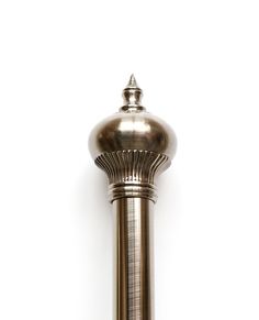 an antique brass lamp on a white background