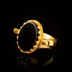 Black Aqeeq Gold Plated Silver Women Ring. Handmade in 925 sterling silver with agate stone. On the ring Oval Black Aqeeq - Agate stone settled. Gold color plated 925 sterling silver. Dimensions of stone is 20 mm x 15 mm. Average weight of Black Aqeeq Gold Plated Silver Women Ring is 8 gr. (depends your ring size). Back side is open and stone touches your skin. Classic and exclusive style. Stone Type: Aqeeq - Agate, Onyx Stone Color: Black Stone Dimensions: 20 mm x 15 mm Stone Shape: Oval Averag Luxury Onyx Jewelry With Hallmark, Luxury Hallmarked Onyx Jewelry, Classic Hallmarked Onyx Jewelry, Formal Onyx Oval Cabochon Jewelry, Hallmarked Round Onyx Jewelry, Round Onyx Hallmarked Jewelry, Hallmarked Onyx Round Jewelry, Silver Handmade Jewelry, Ring Oval