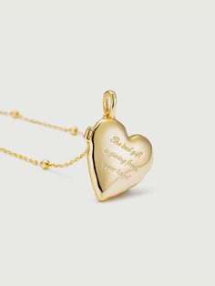 A cherished keepsake that allows you to carry your most precious memories close to your heart. This exquisite pendant features a heart-shaped locket, meticulously crafted with the finest attention to detail and designed to hold a special photo of your choosing. This versatile pendant is suitable for everyday wear or as a special piece for significant occasions. Whether it's a cherished family photo, a picture of a loved one, or a memento of a memorable event, this locket serves as a tangible rem Personalized Open Heart Locket Necklace For Weddings, Elegant Heart Locket Necklace For Mother's Day, Elegant Heart Shaped Locket Necklace For Mother's Day, Elegant Heart Necklace For Valentine's Day Keepsake, Engravable Heart Pendant Jewelry, Open Heart Locket Jewelry For Keepsake, Heart-shaped Locket Jewelry For Memorials, Heart-shaped Locket For Memorial, Open Heart Keepsake Locket