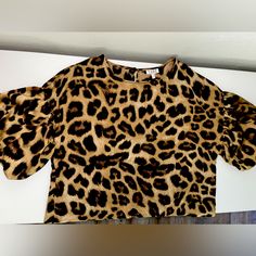 Adorable Leopard Print Short Bell-Sleeve Top! Top Hits Right At Waist. Silky Material - Not Much Stretch. Never Worn - Tags Attached. Leopard Print Short Sleeve Tops For Work, Trendy Short Sleeve Leopard Print Blouse, Fall Leopard Print Short Sleeve Blouse, Short Sleeve Leopard Print Blouse For Fall, Chic Short Sleeve Leopard Print Top, Chic Short Sleeve Leopard Print Blouse, Fitted Leopard Print Blouse With Short Sleeves, American Eagle Sweatshirt, North Face Hoodie