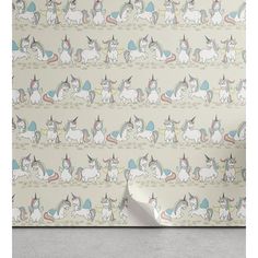 a wallpaper with unicorns on it and a white paper roll in front of it