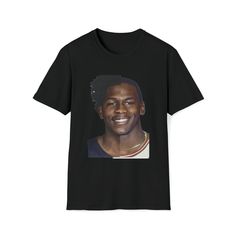 a black t - shirt with an image of a smiling man